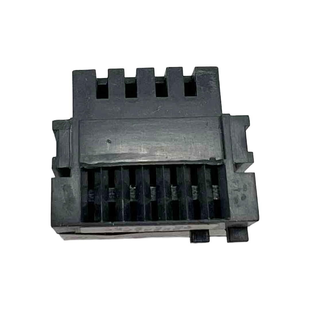 Black plastic component on a white background