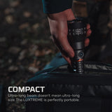 Hand holding a compact flashlight with text about its portability
