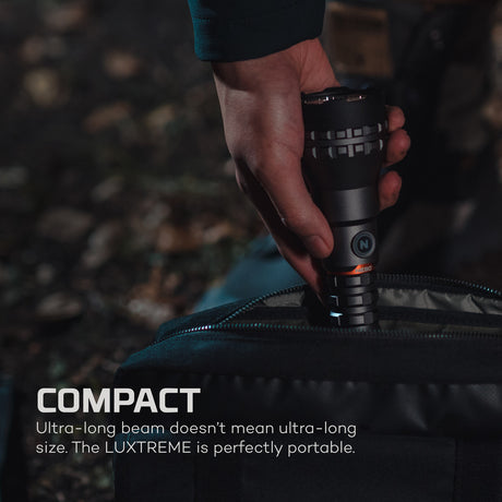 Hand holding a compact flashlight with text about its portability