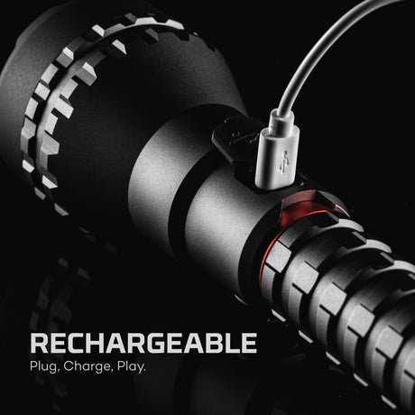 Close-up of a rechargeable device with USB cable on a black background